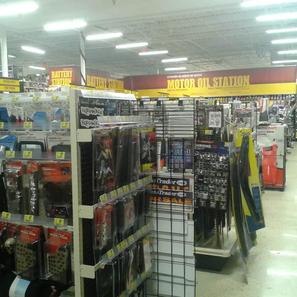 Packaged automotive accessories and maintenance products on display racks.