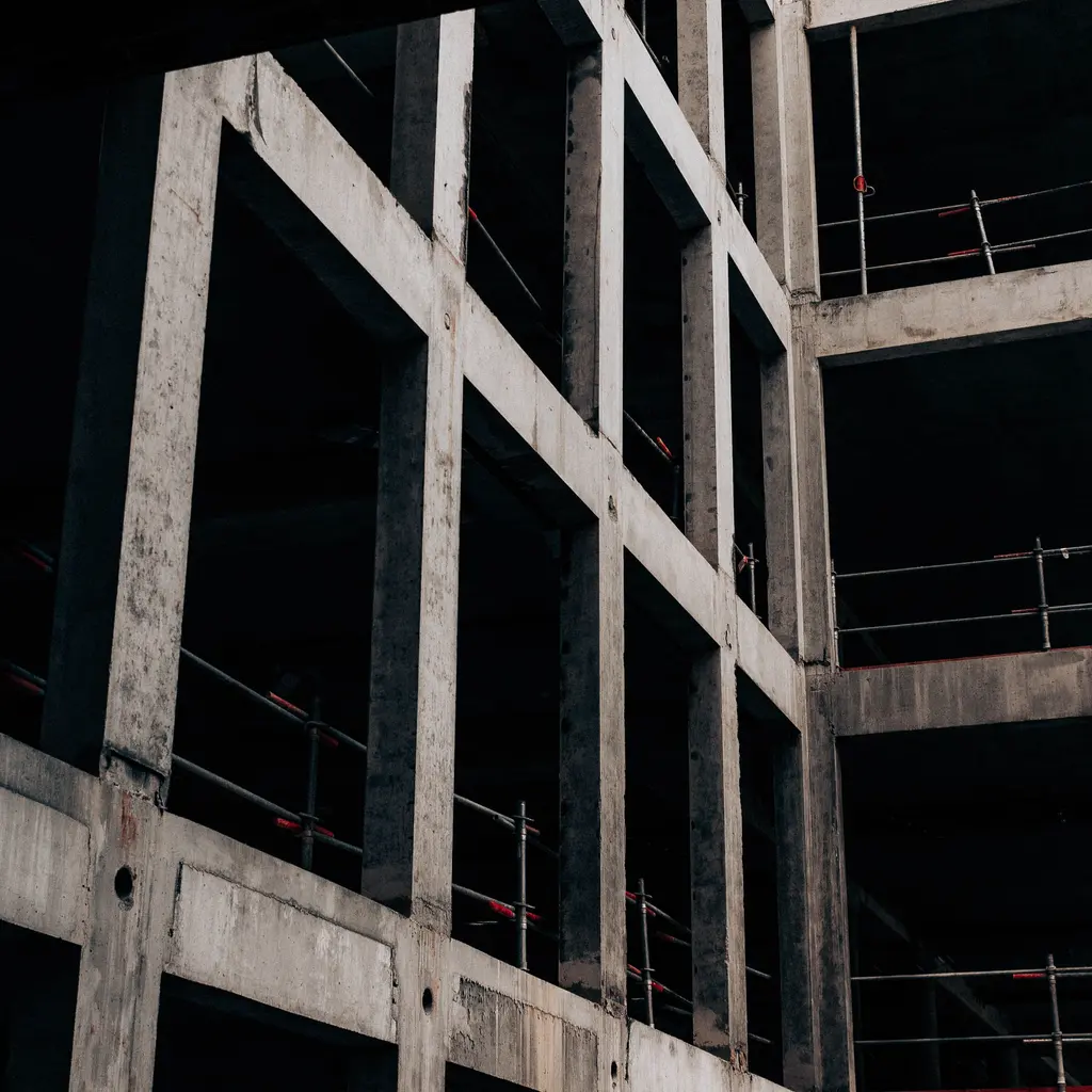 Exposed reinforced-concrete columns and floor slabs of a multistory building under construction.