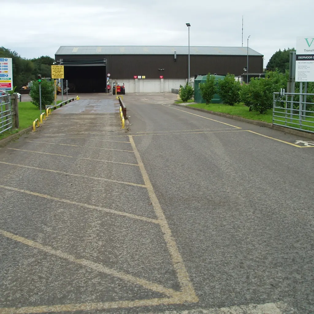 A vehicle weighbridge beside a site reception building.