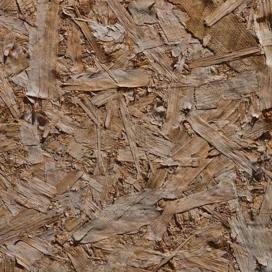 Close-up of compressed wood strands in an oriented strand board panel.
