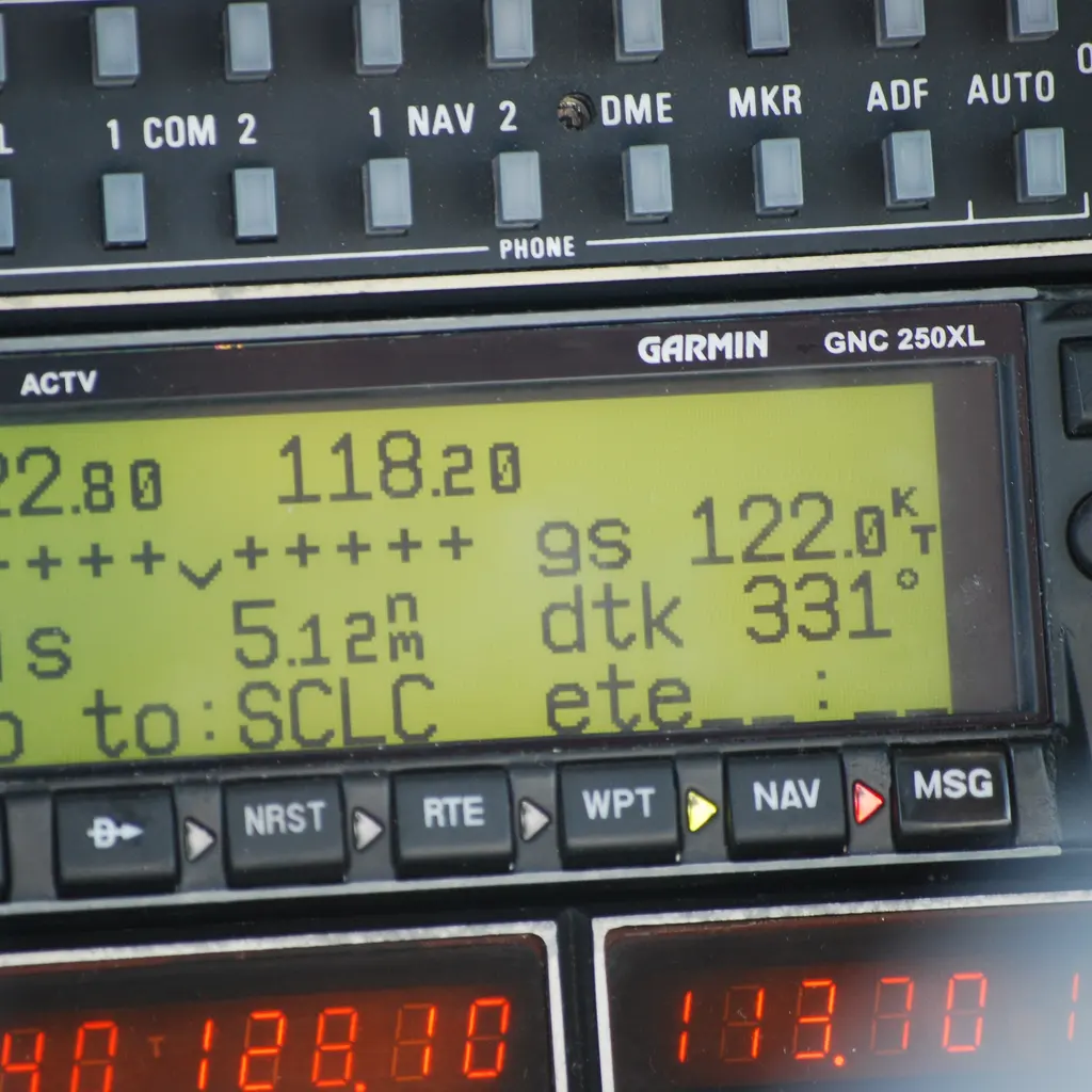 An aircraft GPS navigation receiver showing waypoint, distance and track information.