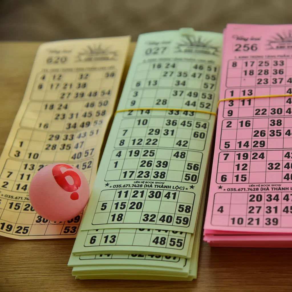 Stacks of numbered bingo ticket strips with a calling ball.