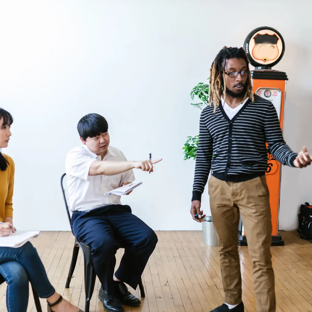 An instructor leading a small group of adults through a training session.
