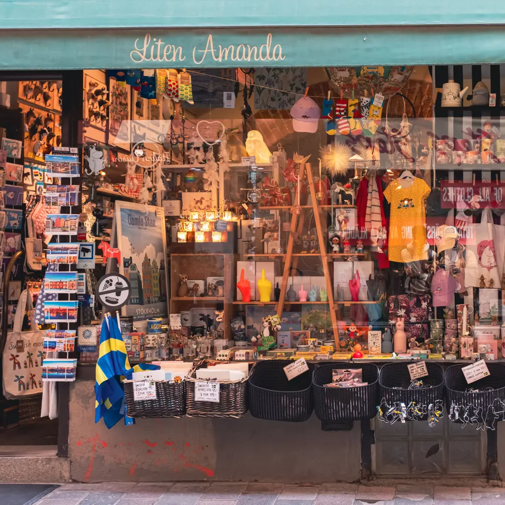Small ornaments, postcards and colorful souvenirs displayed at a gift-shop entrance.