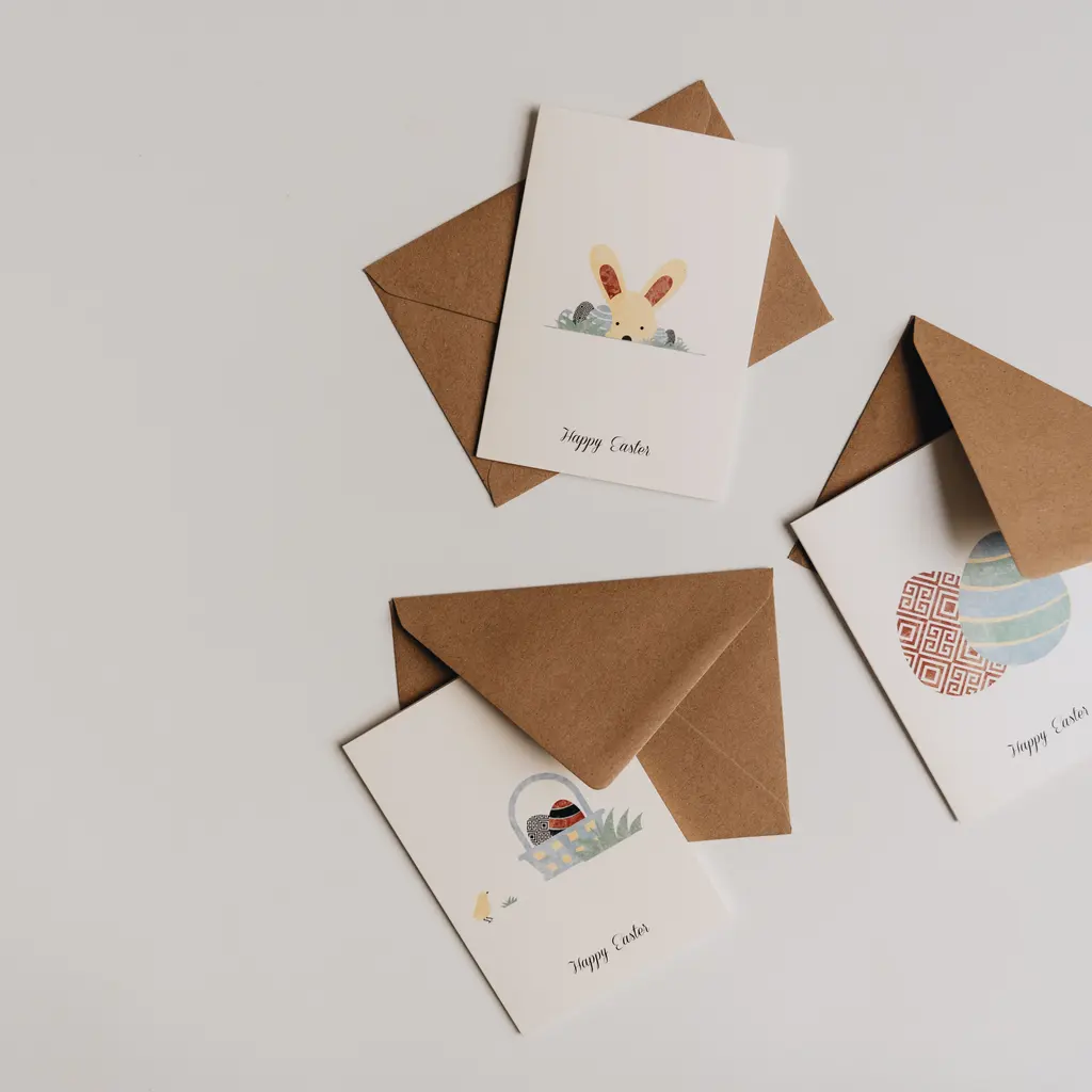 Printed Easter greeting cards arranged with paper envelopes.