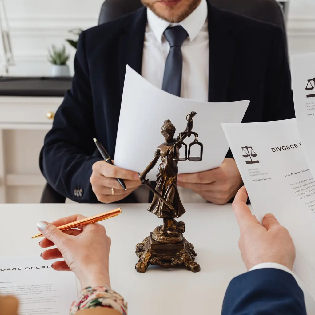 Legal documents being reviewed across a law-office desk.