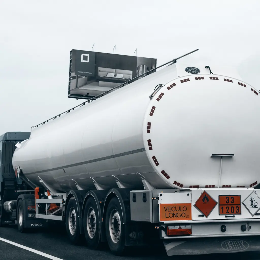 A fuel tank trailer traveling along a highway.