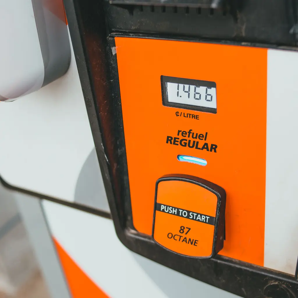 A fuel dispenser's regular-gasoline selector and price display.