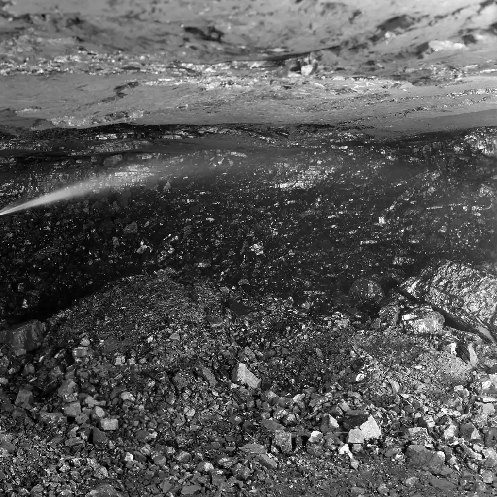 Water sprayed onto the coal face in an underground mine.