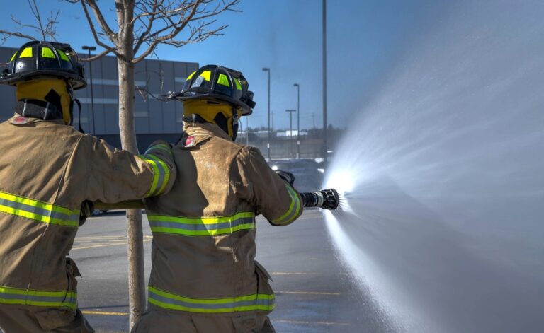 Firefighters demonstrate safety techniques, vital for home fire safety tips, evacuation plans, and essentials.