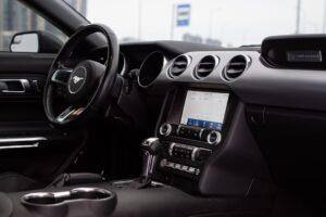 Interior view of a modern car, illustrating the role of telematics in modern auto insurance policies.