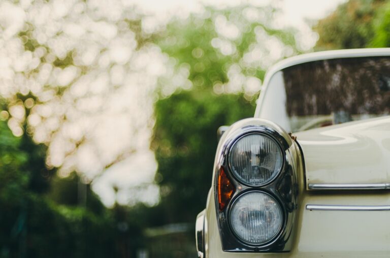 Car close-up with blurred background, highlighting key considerations for insurance when buying a new car.
