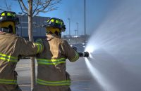 Firefighters demonstrate safety techniques, vital for home fire safety tips, evacuation plans, and essentials.