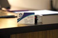 Business card on a desk representing insights on what Medicare doesn't cover and how to fill the gaps.