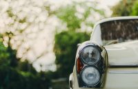 Car close-up with blurred background, highlighting key considerations for insurance when buying a new car.